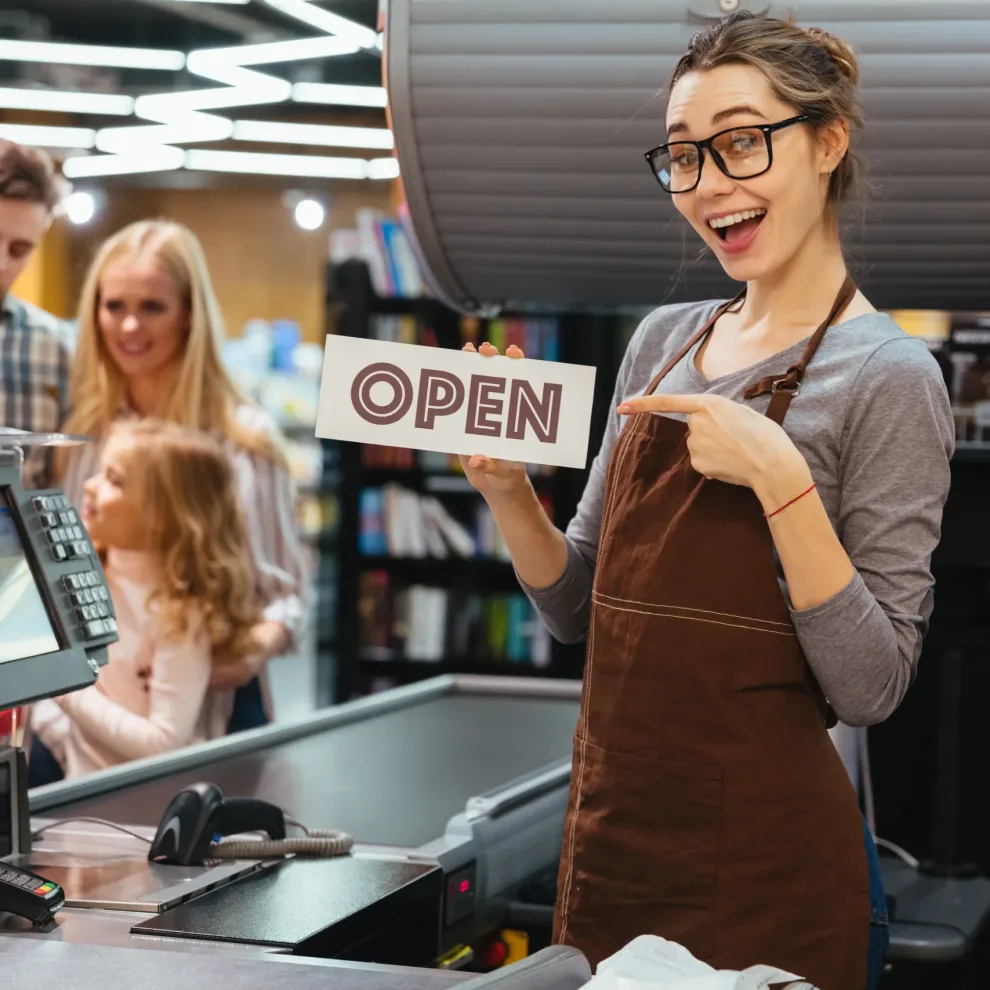 Portrait of smiling woman cashier